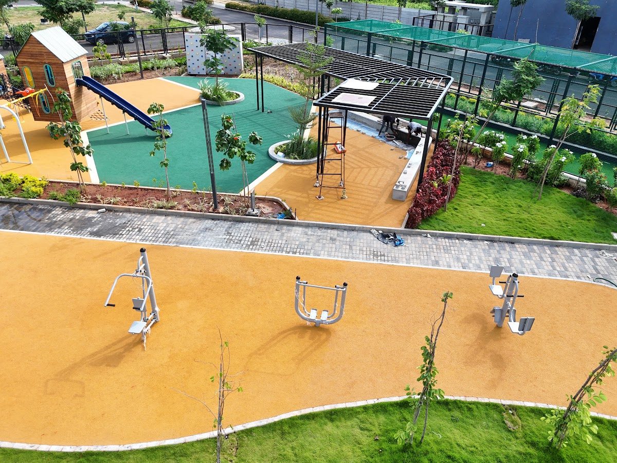 Outdoor fitness equipment on coloured safety flooring