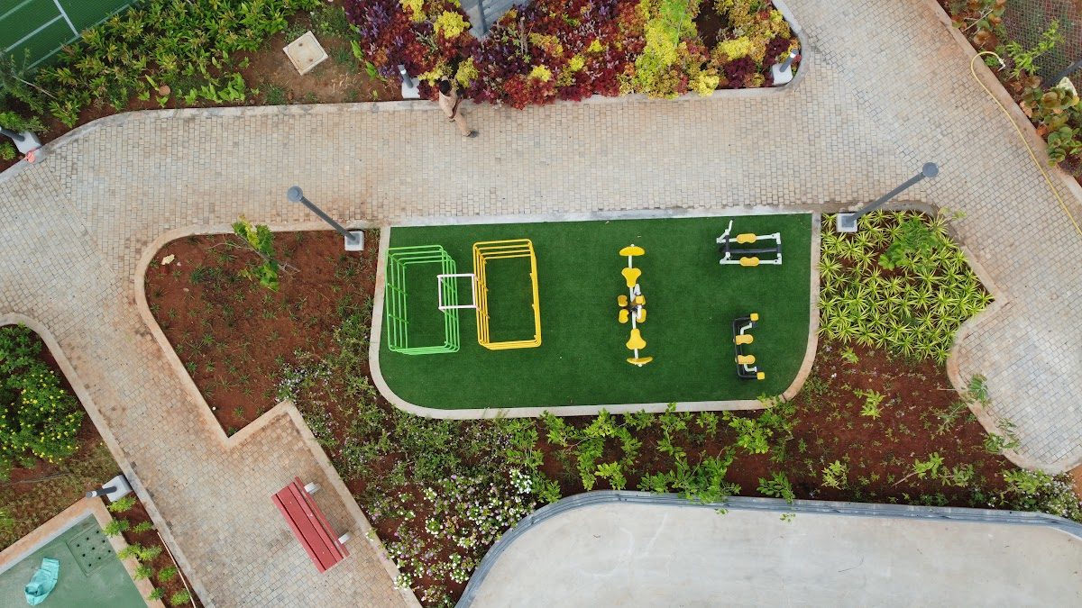 Green fitness turf with exercise frames seen from above