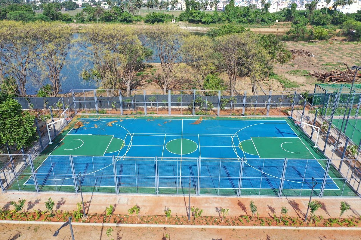 Blue and green multi-sport court with fencing