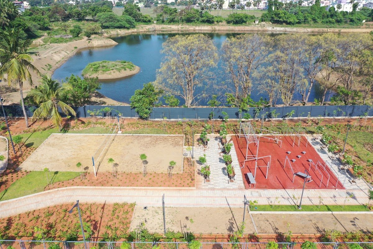 Sports courts and gardens along a lake edge