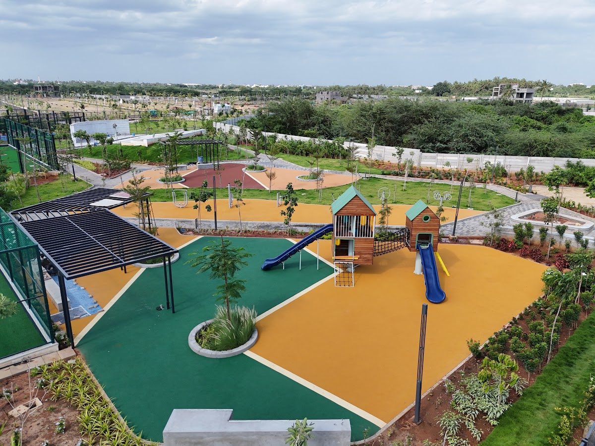 Aerial view of play gardens with slides and safety flooring
