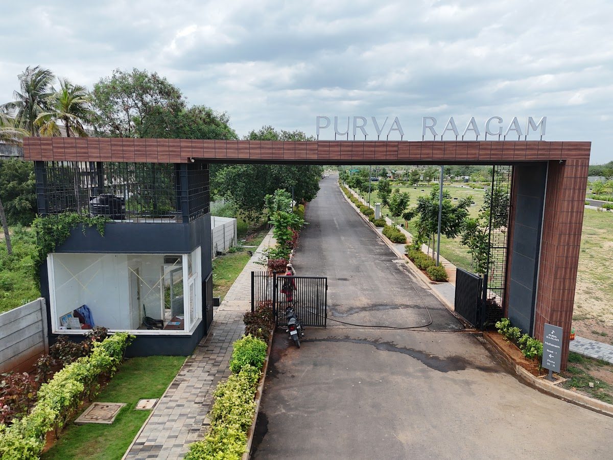 Grand entrance gateway with planted avenue