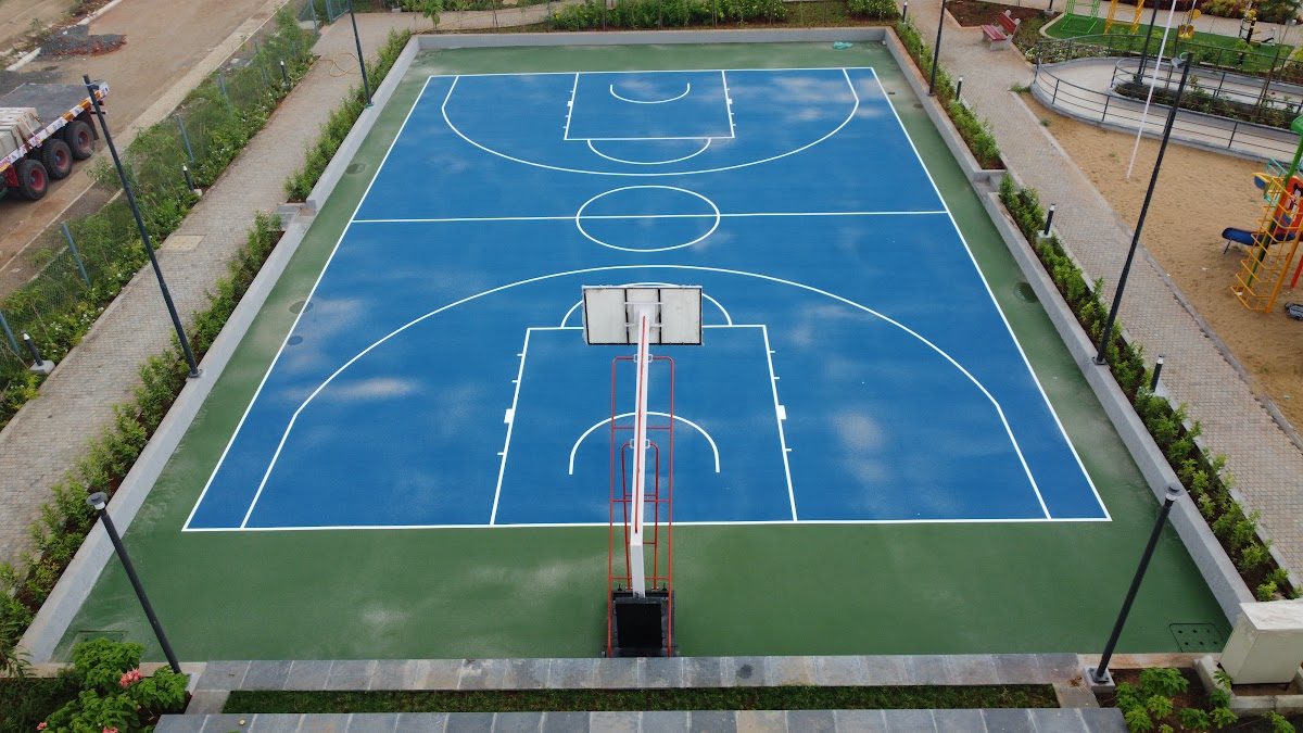 Blue basketball court with white line marking seen from above