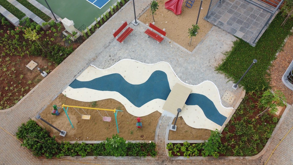 Wavy blue and cream patterned play flooring seen from above